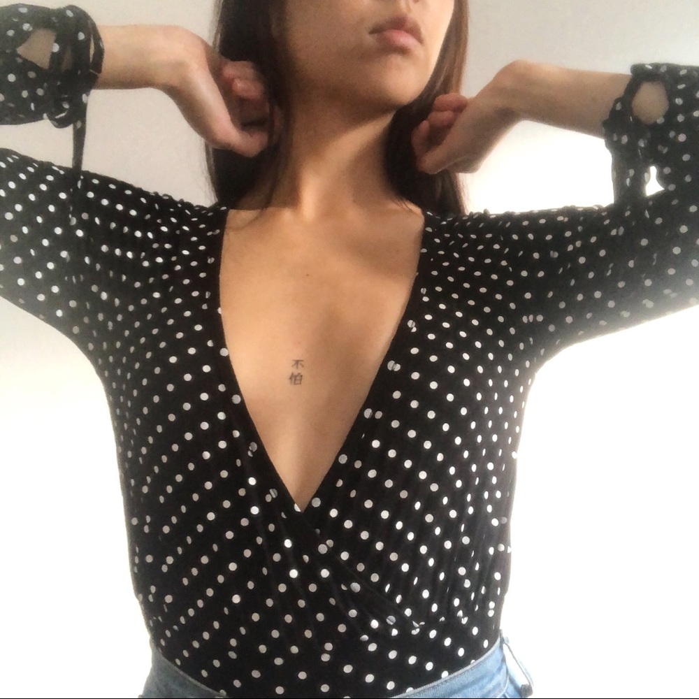 Plunge neck polka-dot bodysuit